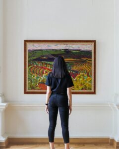 woman in black long sleeve shirt and black pants standing on white concrete staircase